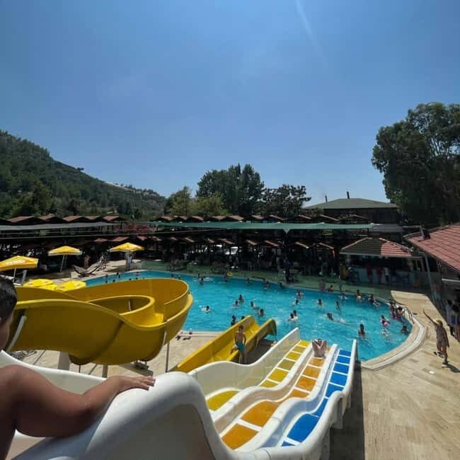 Alanya: Dim Cave, Dim River Tour With Lunch and Fresh Fruits - Dam lake bridge photos with music and the road back