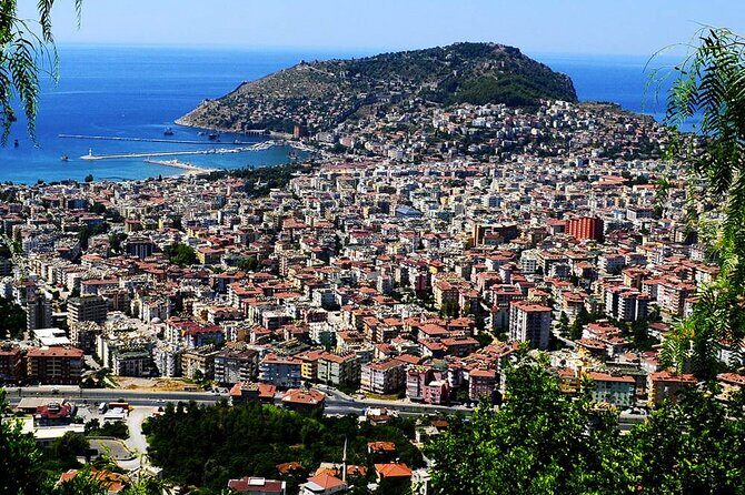 From Alanya: Sightseeing Half Day City Tour w/Cable Car - Panorama Hotel photo break and the sunset feel
